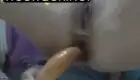 A beautiful young woman with big tits fucks her ass and gets shit all over the place